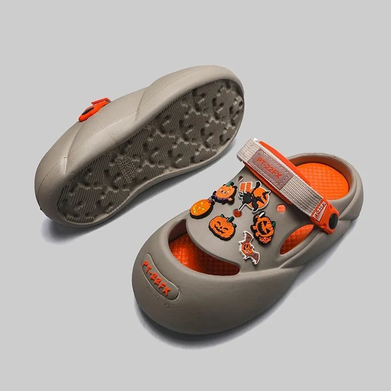 Men's grey baotou beach shoes with hole design and lightweight EVA sole on a sandy background.