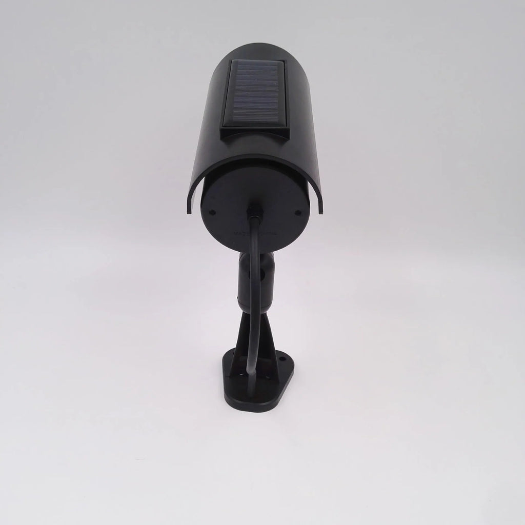 Black gun-style fake surveillance camera with solar simulation flashing light for security deterrent