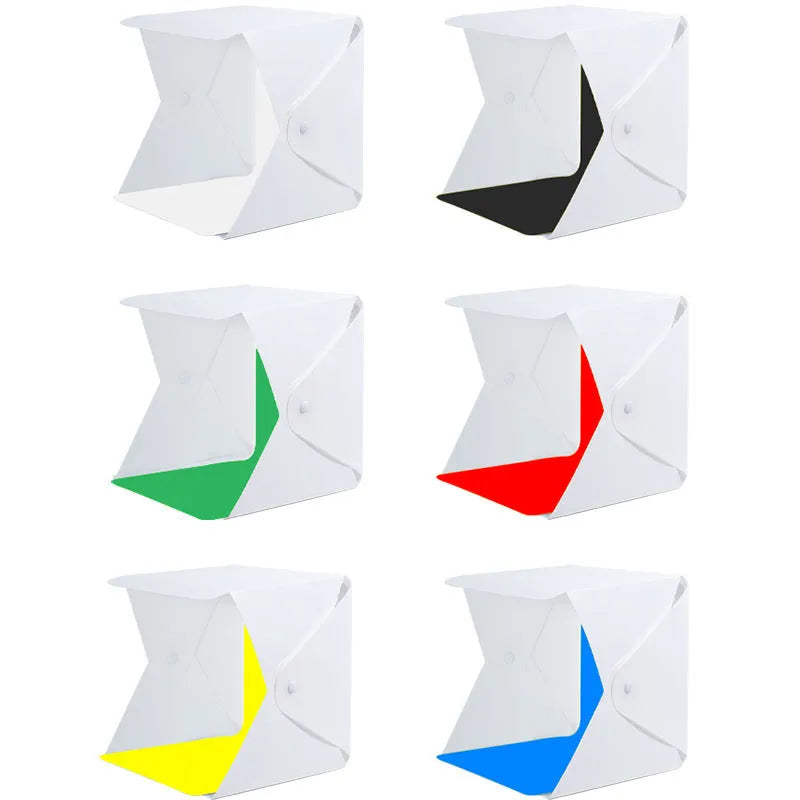 40cm folding photography light box with LED ring light and multiple coloured background cloths setup for product shooting.