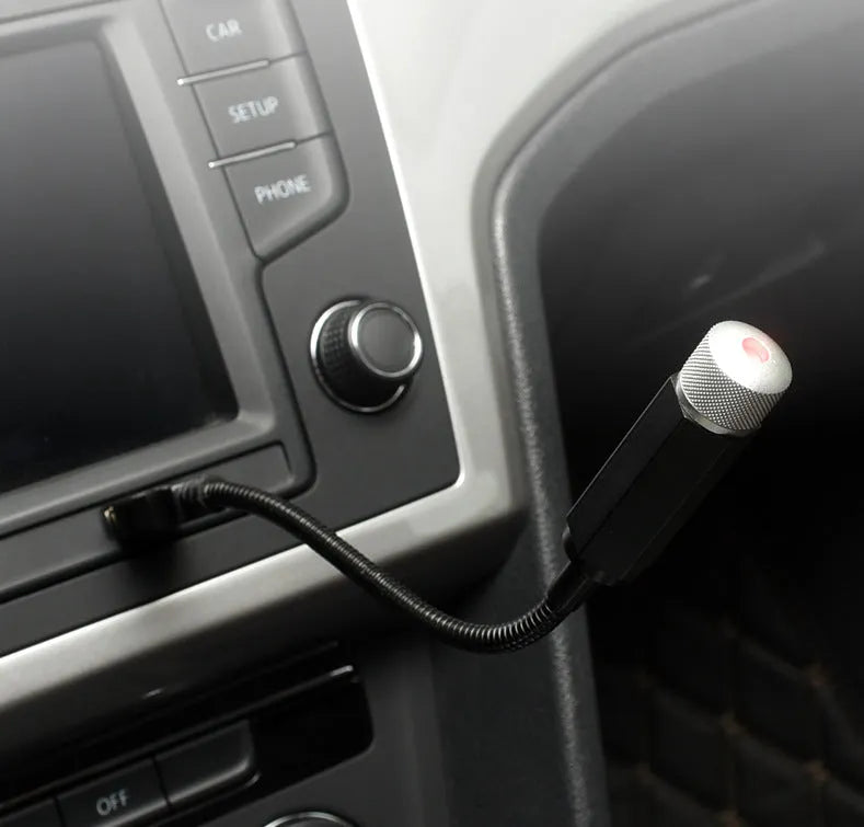 Car roof star light with aluminium housing and USB hose connection showing purple starry sky illumination