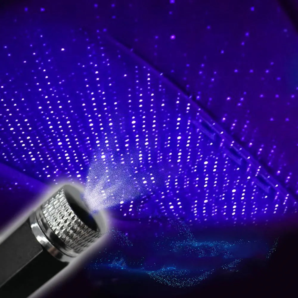 Car roof star light with aluminium housing and USB hose connection showing purple starry sky illumination