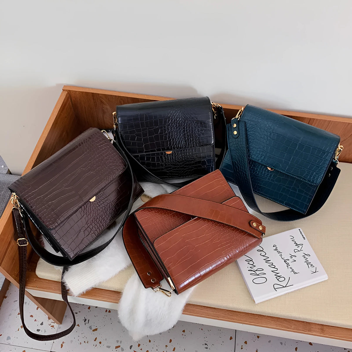 Stone pattern small square shoulder bag in PU with 25 cm width, double strap, and inner phone pocket.