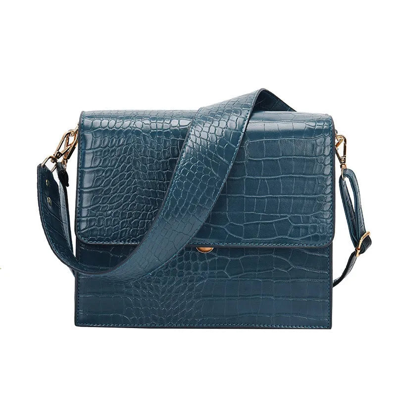 Stone pattern small square shoulder bag in PU with 25 cm width, double strap, and inner phone pocket.