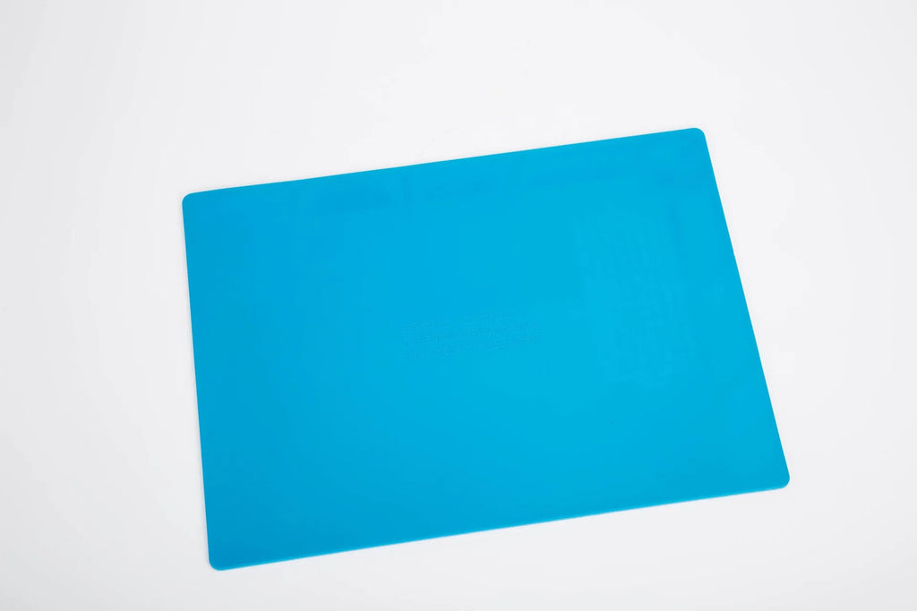 Blue silicone watch repair table mat for non-slip watchmaking and jewellery work