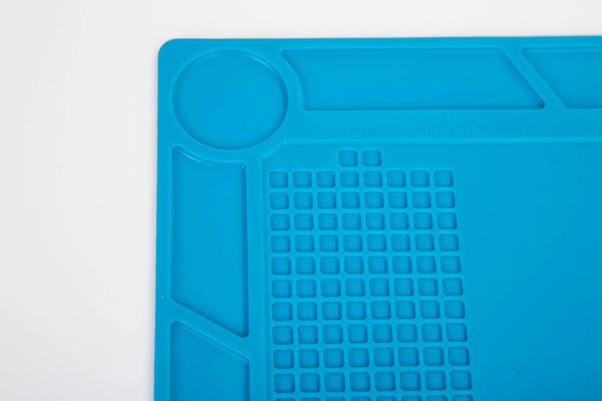 Blue silicone watch repair table mat for non-slip watchmaking and jewellery work