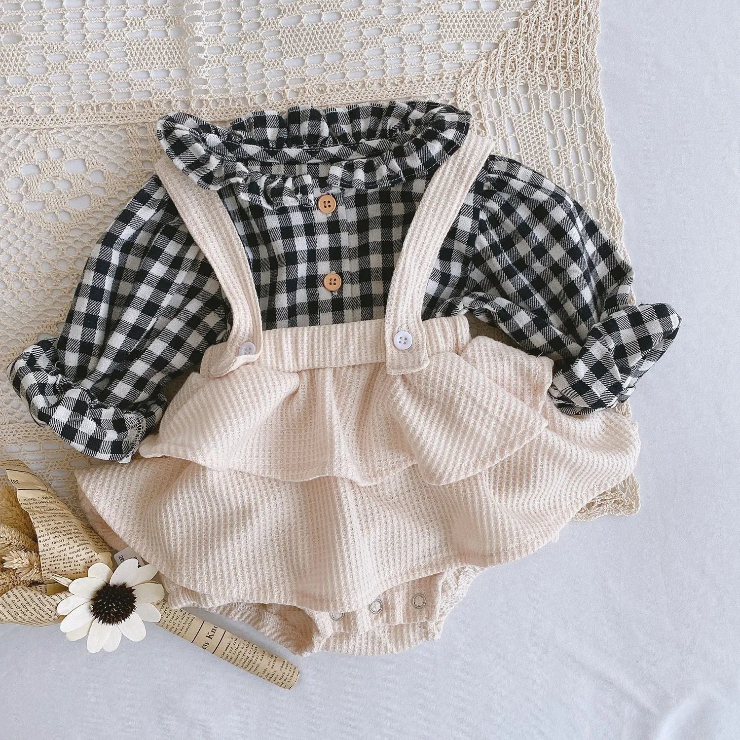 Apricot coloured baby romper with pleated lotus leaf design and sling climbing suit style for 0-2 year olds.