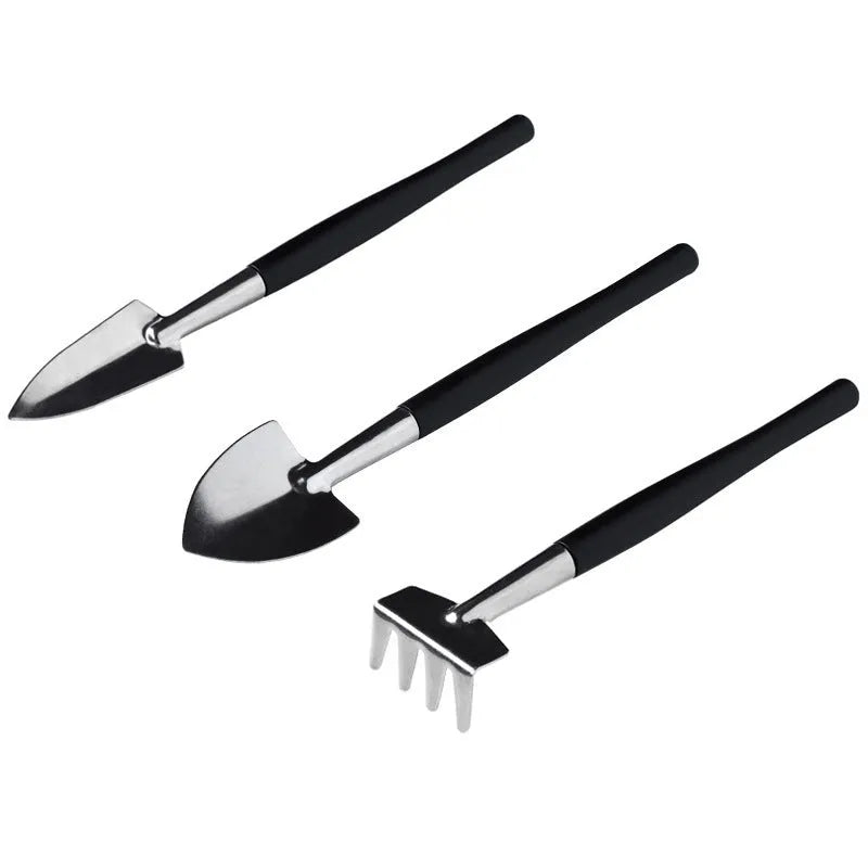 Black plastic and metal succulent gardening tool set with 15 pieces including watering bottle on 75cm square cushion