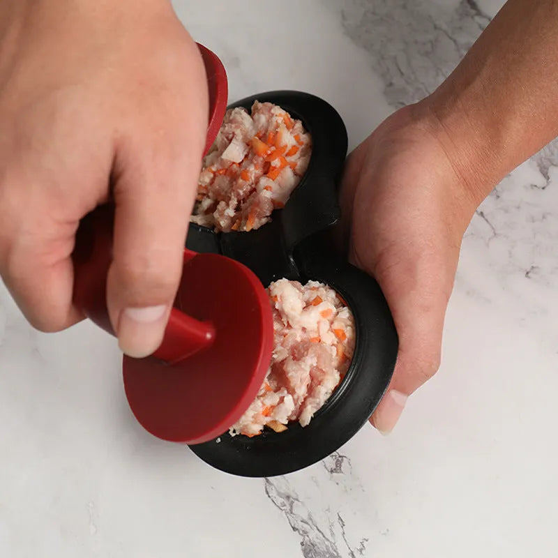 Black and red burger press gadget with non-stick moulds for making patties up to 3/4 pounds.