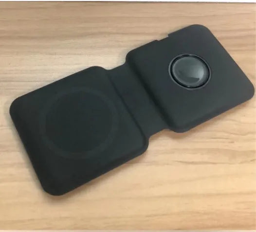 White foldable magnetic wireless charging dock showing two charging surfaces on a desk.