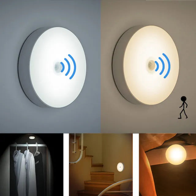 Small round beige and white LED motion sensor night light with USB charging cable.