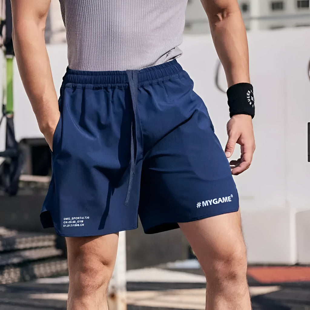 Men's gray quick-dry training shorts made from a stretchy polyester and spandex fabric blend.