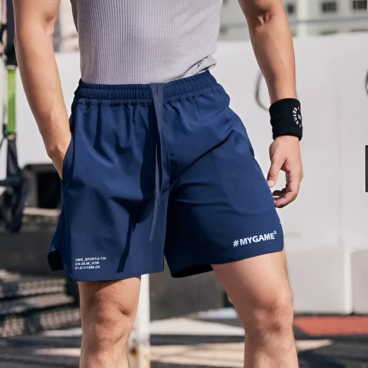 Men's gray quick-dry training shorts made from a stretchy polyester and spandex fabric blend.