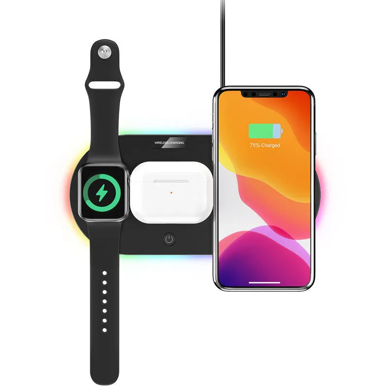 Black circular 15W wireless charging pad with USB port on desk next to phone