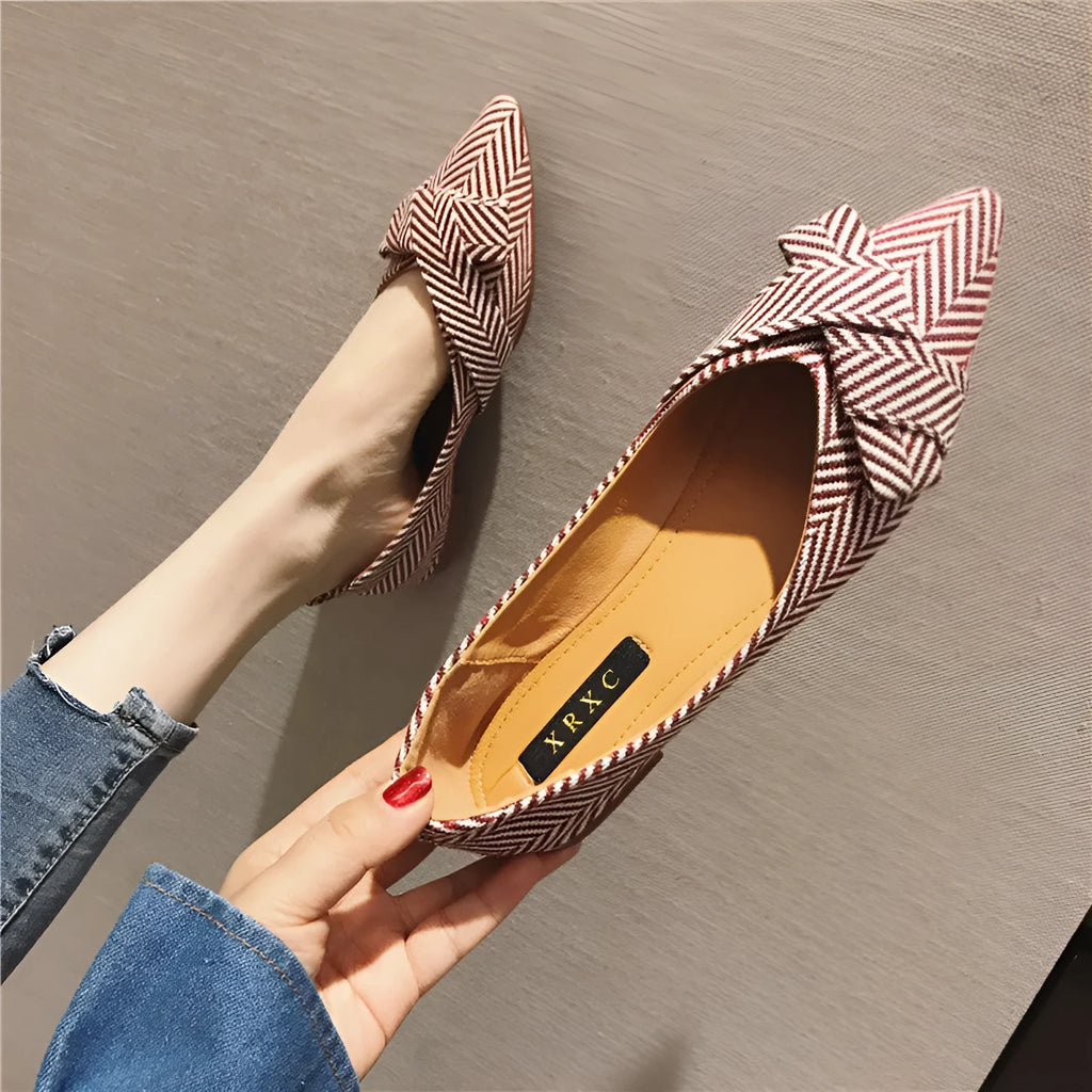 Women's pointed toe shallow mouth single shoes in black and red colours showing low heel design