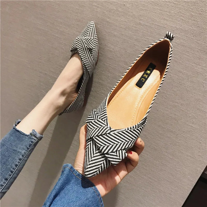 Women's pointed toe shallow mouth single shoes in black and red colours showing low heel design