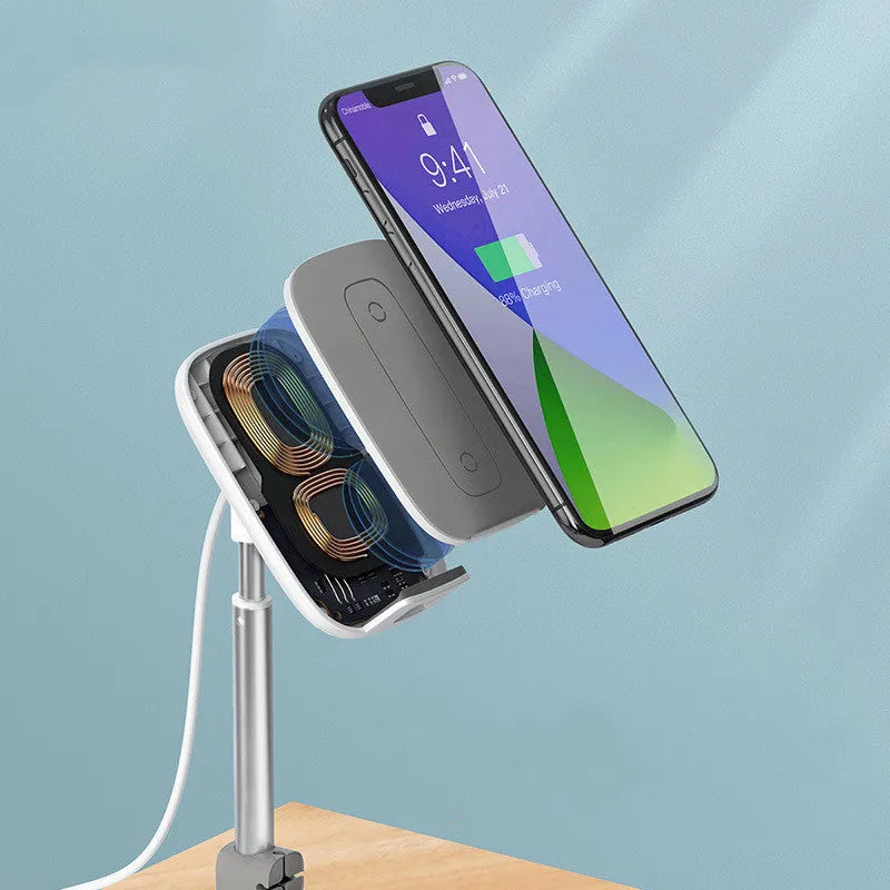 Baseus 15W wireless charger stand with adjustable tablet holder in silver, holding a smartphone on a desktop