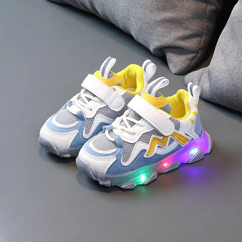 Kids' black breathable mesh sneakers with Velcro straps and a rubber sole.