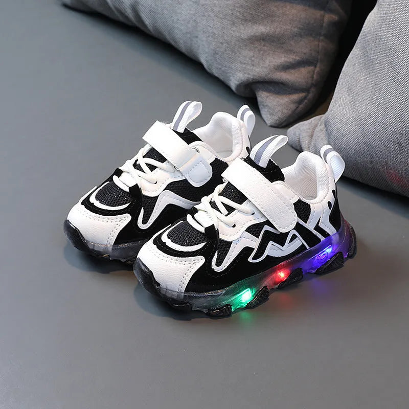 Kids' black breathable mesh sneakers with Velcro straps and a rubber sole.