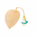 KC alloy bookmark charms showing Alice, Rabbit, Clock, and Leaf designs on kraft cardboard packaging