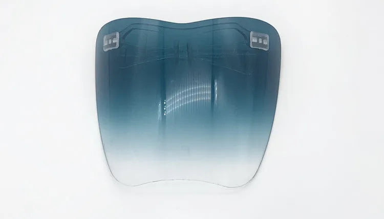Protective goggles with transparent PC frame and gradient grey lens on white background