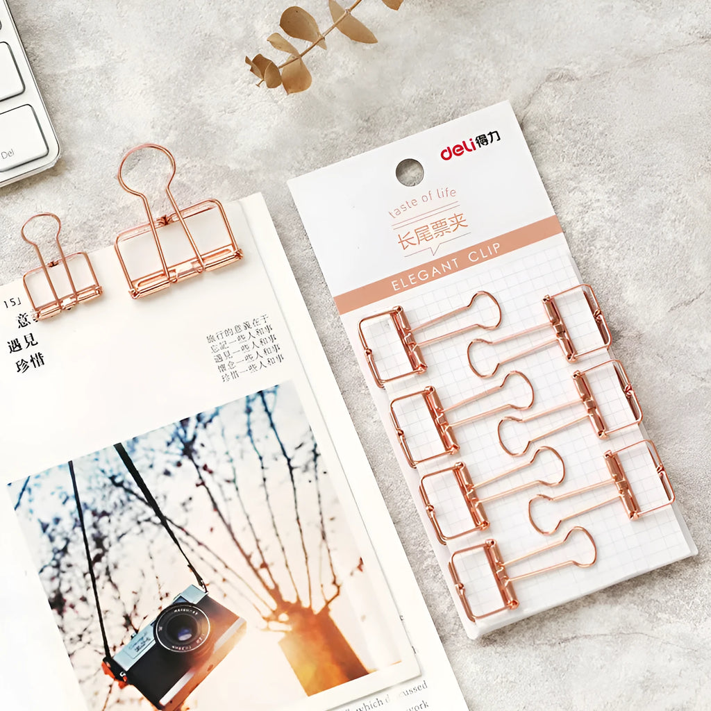 Rose gold metal binder set showing small and large folders for ticket and document organisation.