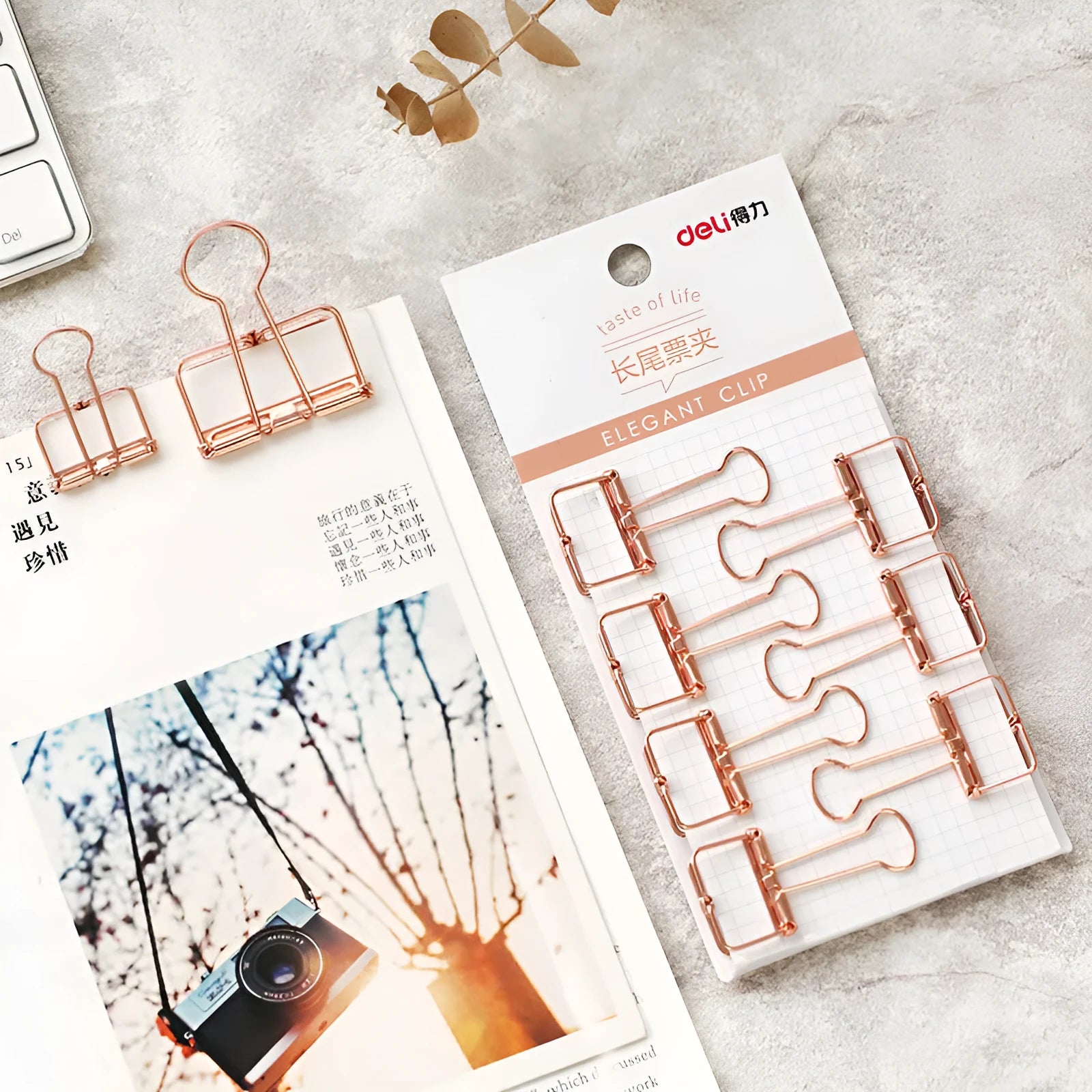 Rose gold metal binder set showing small and large folders for ticket and document organisation.