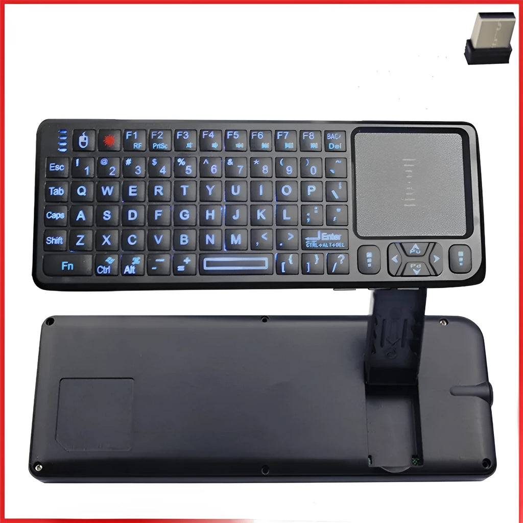 Black wireless mini keyboard with touch screen and matching laser mouse on a desk.