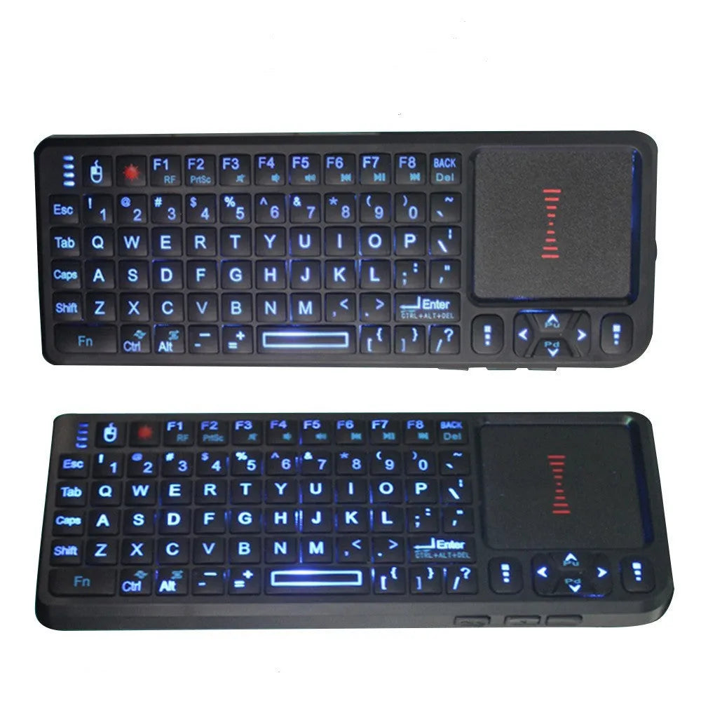 Black wireless mini keyboard with touch screen and matching laser mouse on a desk.