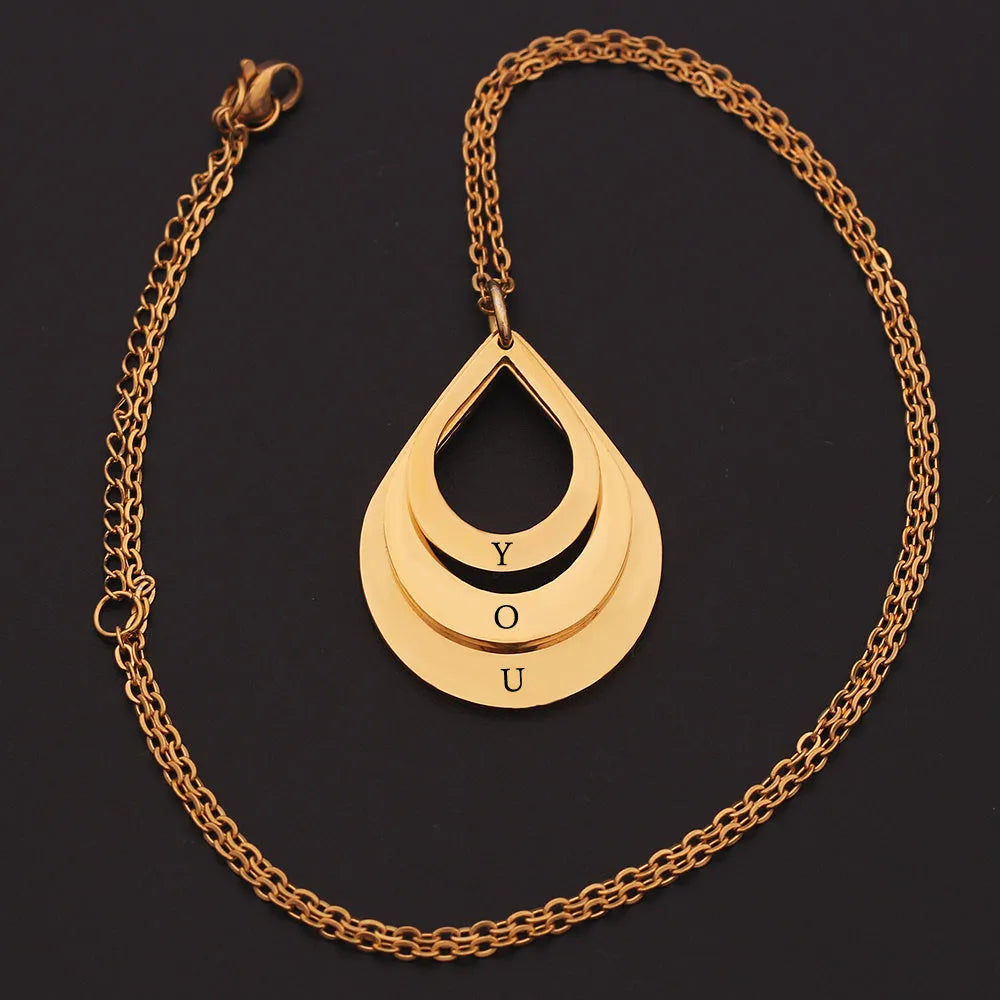 Custom engraved stainless steel pendant necklace with three water droplet design in gold, silver, and rose gold