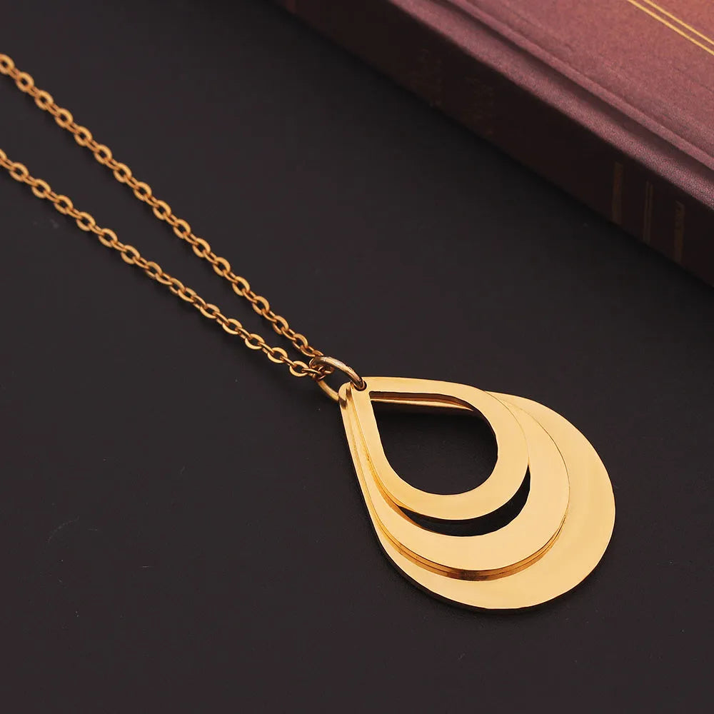 Custom engraved stainless steel pendant necklace with three water droplet design in gold, silver, and rose gold