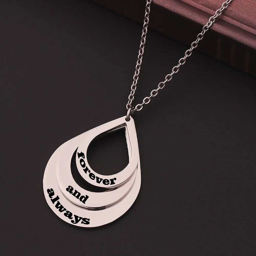 Custom engraved stainless steel pendant necklace with three water droplet design in gold, silver, and rose gold