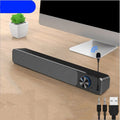 G18 black and white desktop computer speaker with USB cable and Bluetooth connectivity on a wooden desk.