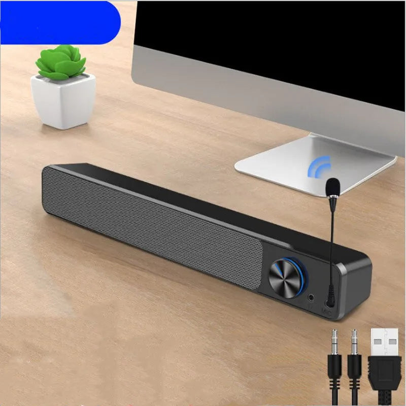G18 black and white desktop computer speaker with USB cable and Bluetooth connectivity on a wooden desk.