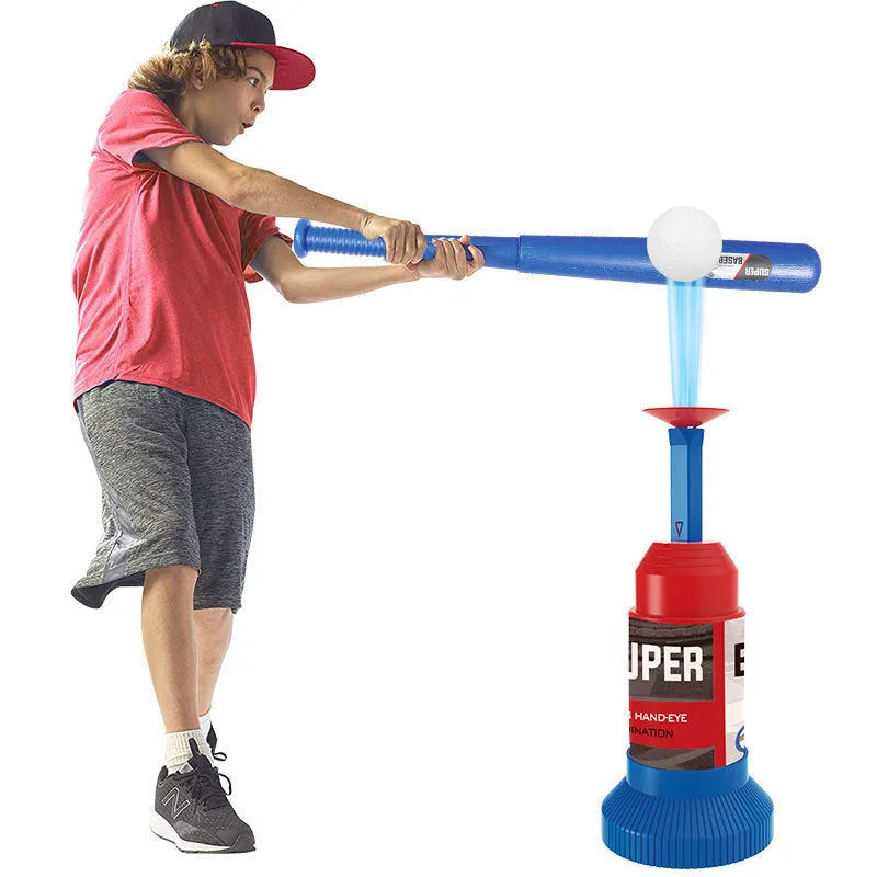Children's baseball serving trainer with step pedal, three baseballs, and collapsible plastic bat on grass