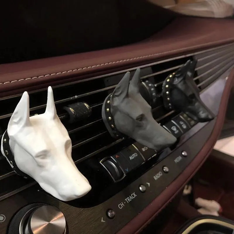 Doberman-shaped car air freshener solid diffuser vent clip in black colour on car air vent