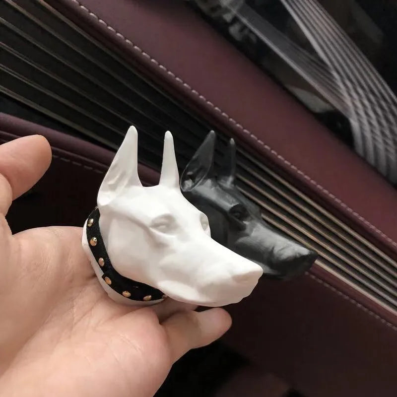 Doberman-shaped car air freshener solid diffuser vent clip in black colour on car air vent