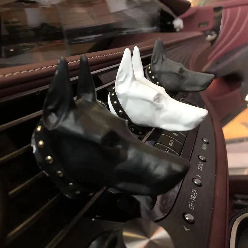 Doberman-shaped car air freshener solid diffuser vent clip in black colour on car air vent