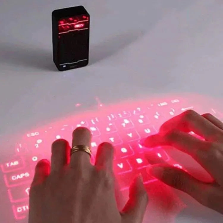 Laser projection keyboard in black projecting a virtual keyboard alongside a smartphone