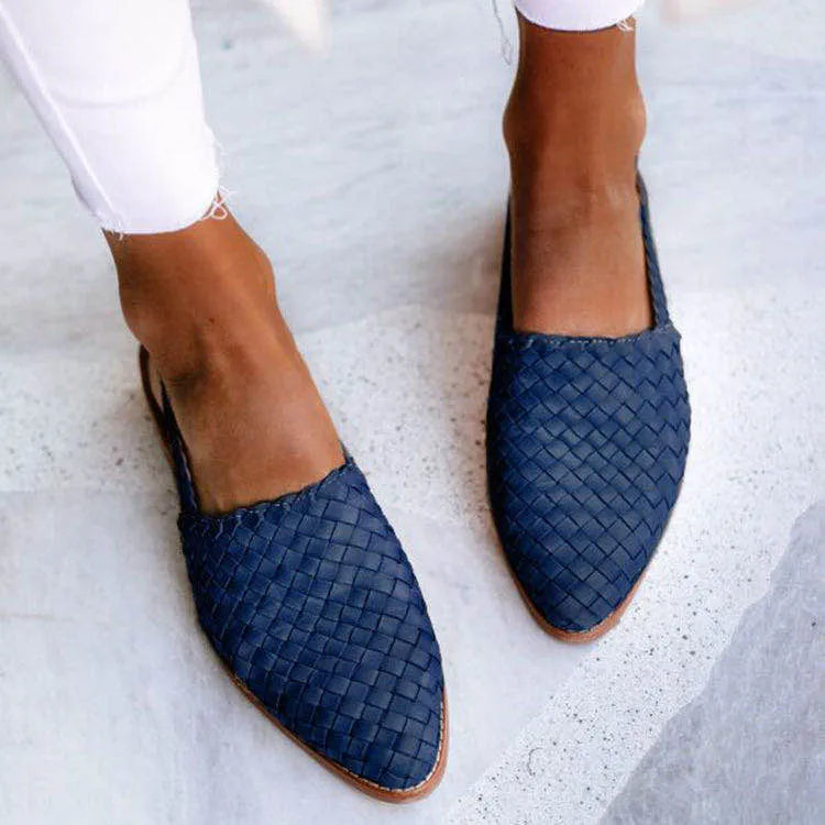 Baotou flat sandals with a buckle strap and pointed toe in multiple colour options.