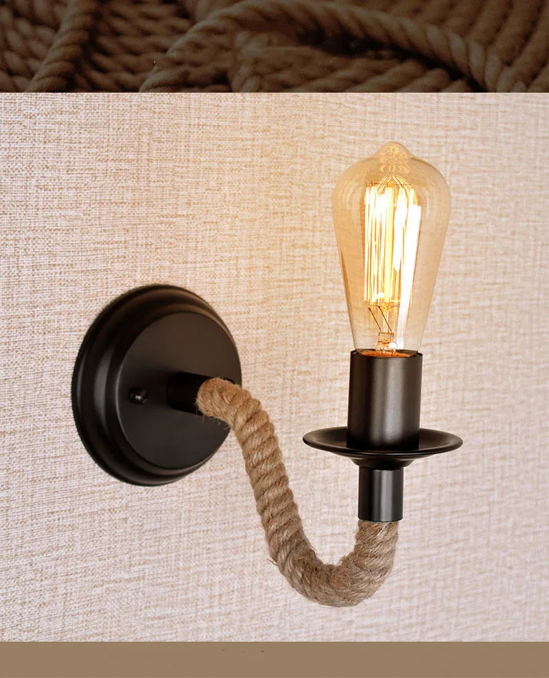 Retro creative wrought iron twine wall lamp in black with handmade hemp rope wrap on a bedside table