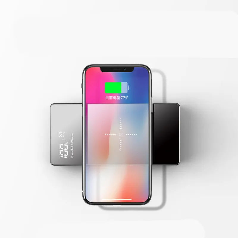 Black wireless power bank with digital display showing battery percentage, featuring a mirror finish and two USB ports.