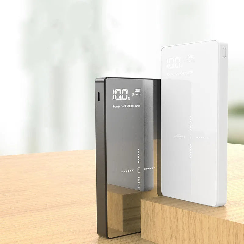 Black wireless power bank with digital display showing battery percentage, featuring a mirror finish and two USB ports.