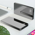 Black wireless power bank with digital display showing battery percentage, featuring a mirror finish and two USB ports.