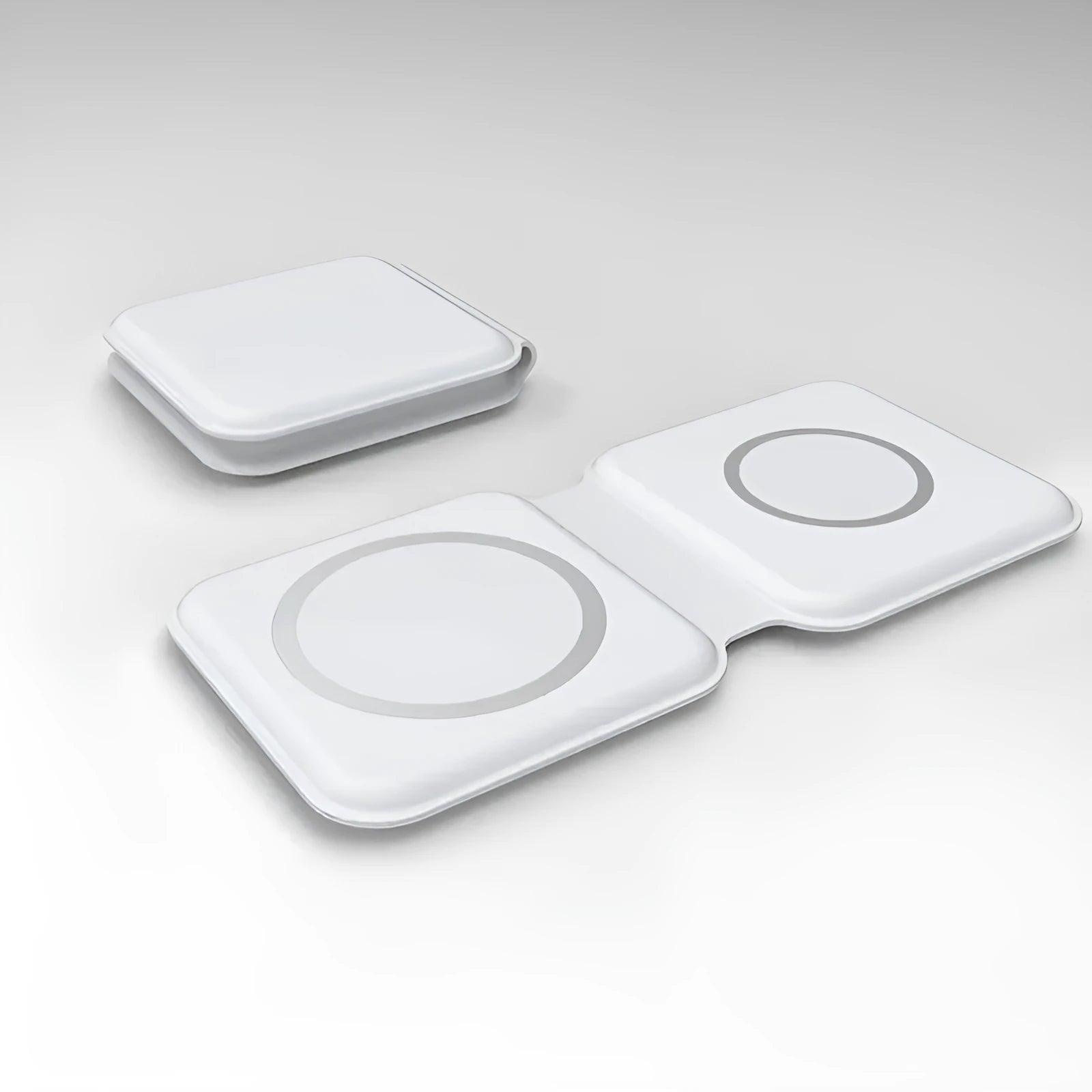 White foldable magnetic wireless charging dock showing two charging surfaces on a desk.