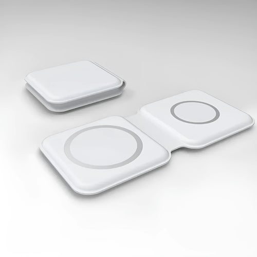 White foldable magnetic wireless charging dock showing two charging surfaces on a desk.