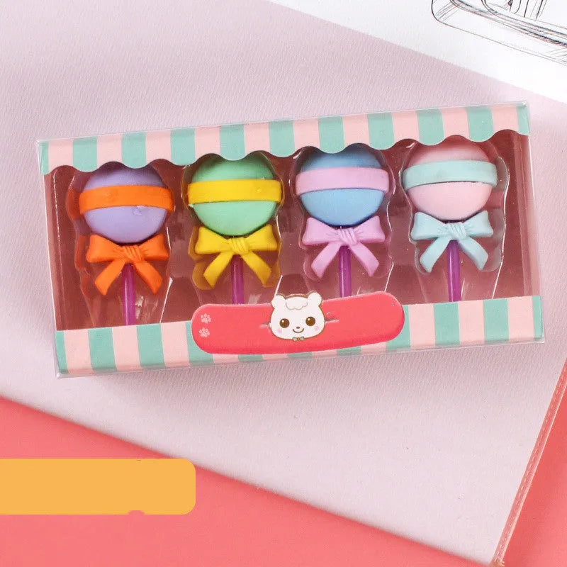 Assortment of 12 colourful cartoon food shaped pencil erasers including ice cream cones, donuts, and lollipops.
