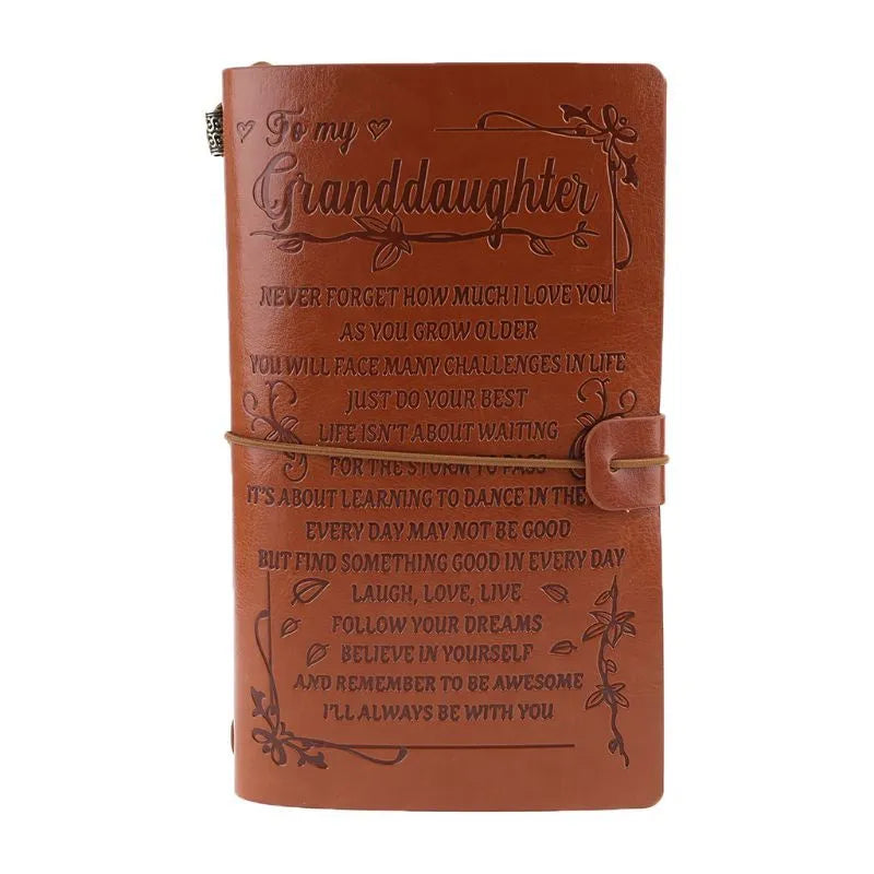Brown leather hand ledger business notebook with strap binding closed