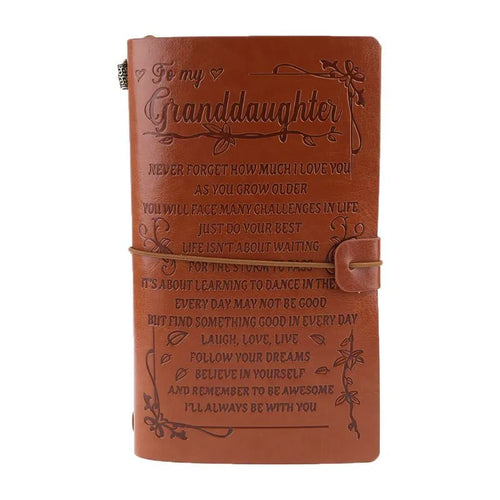 Brown leather hand ledger business notebook with strap binding closed