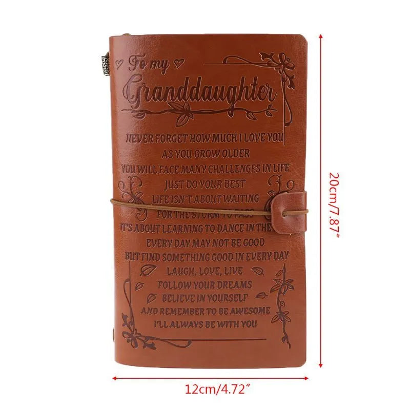 Brown leather hand ledger business notebook with strap binding closed