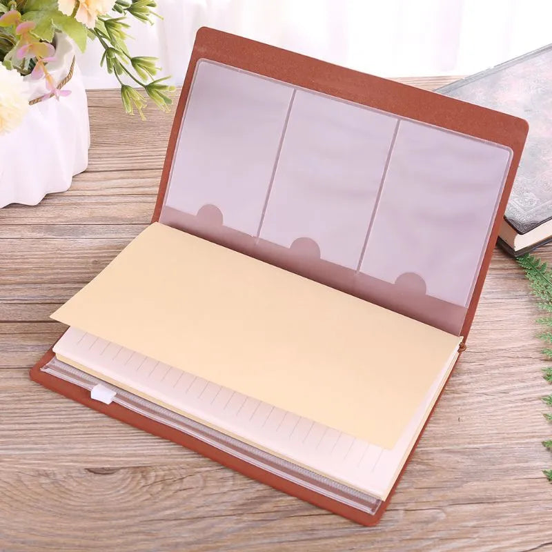 Brown leather hand ledger business notebook with strap binding closed